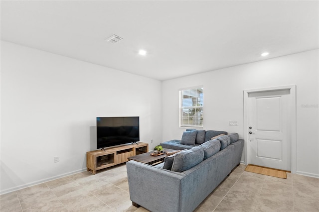 living area featuring light tile patterned floors, visible vents, recessed lighting, and baseboards