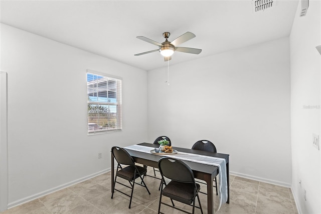 home office featuring visible vents, baseboards, and a ceiling fan