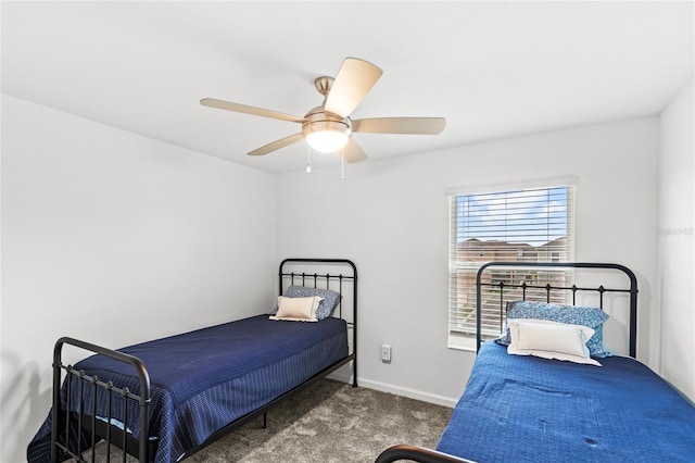 carpeted bedroom featuring a ceiling fan and baseboards