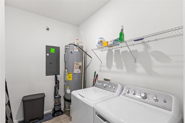 washroom featuring independent washer and dryer, electric panel, water heater, light tile patterned floors, and laundry area