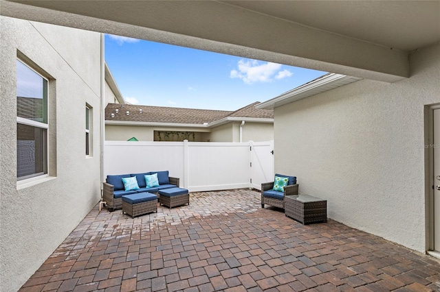 view of patio / terrace featuring outdoor lounge area and fence