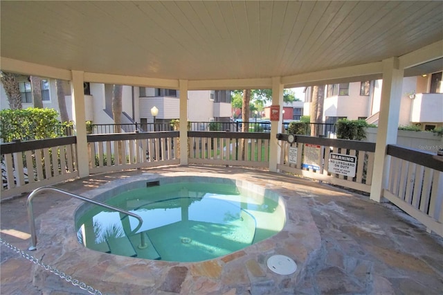 view of pool with a community hot tub