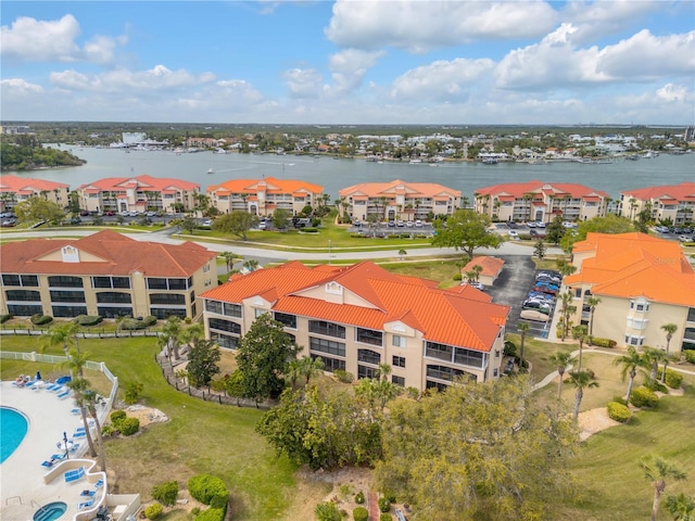 birds eye view of property featuring a residential view and a water view