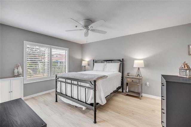 445 Bouchelle Dr Unit 104, New Smyrna Beach, FL 32169 - bedroom with light wood finished floors and a ceiling fan