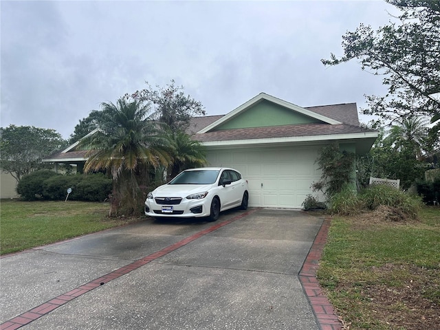 view of home's exterior with a lawn, driveway, an attached garage, and roof with shingles