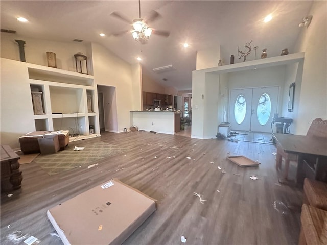 living area featuring visible vents, high vaulted ceiling, wood finished floors, and a ceiling fan