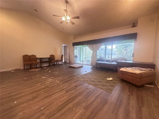 living area featuring ceiling fan, wood finished floors, and high vaulted ceiling