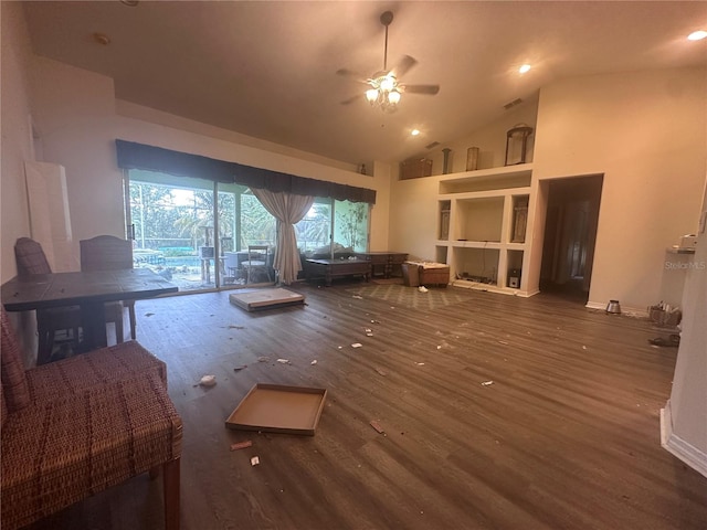 unfurnished living room featuring visible vents, ceiling fan, baseboards, wood finished floors, and high vaulted ceiling