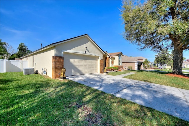 single story home featuring fence, an attached garage, central AC, stucco siding, and brick siding