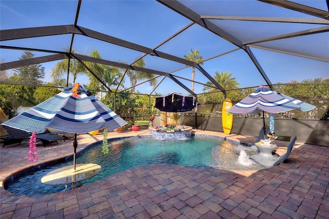 outdoor pool with a lanai and a patio