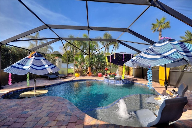 pool with a patio, a lanai, and fence