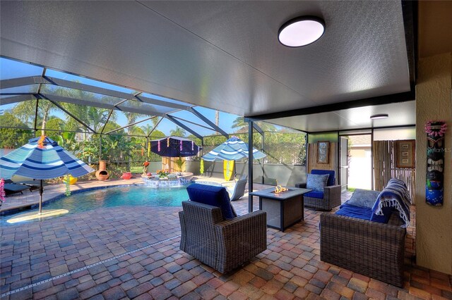 outdoor pool with a patio area, a jacuzzi, a fire pit, and a lanai