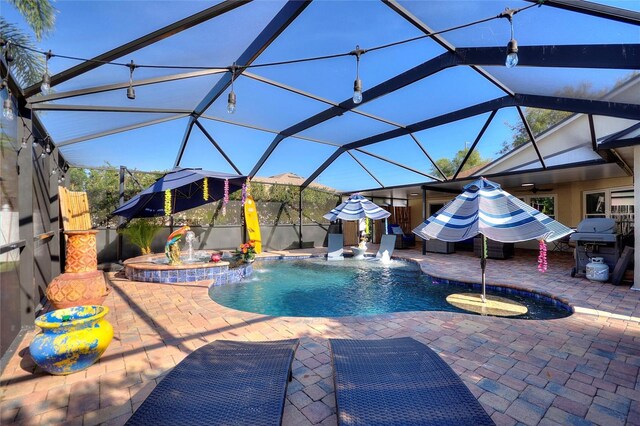 outdoor pool featuring glass enclosure, a patio, grilling area, and a hot tub