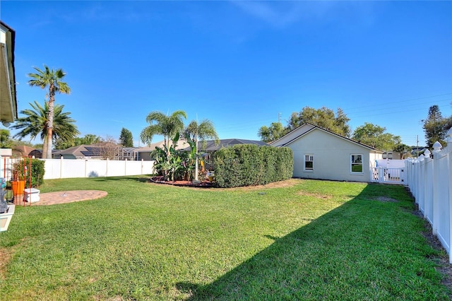 view of yard with a fenced backyard