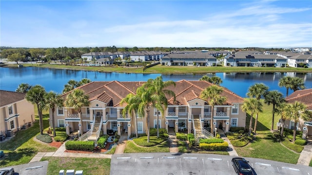 bird's eye view featuring a residential view and a water view