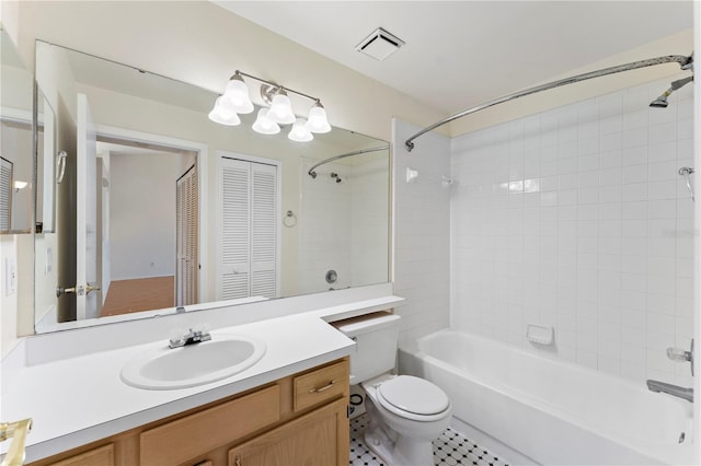 bathroom with visible vents, toilet, shower / washtub combination, and vanity