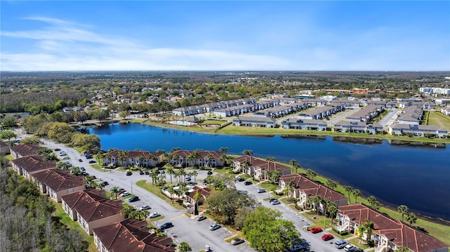 bird's eye view featuring a water view and a residential view