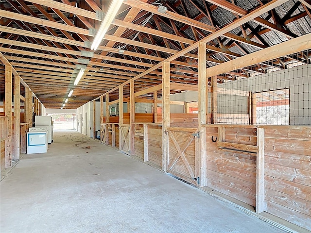 view of stable with washer / dryer