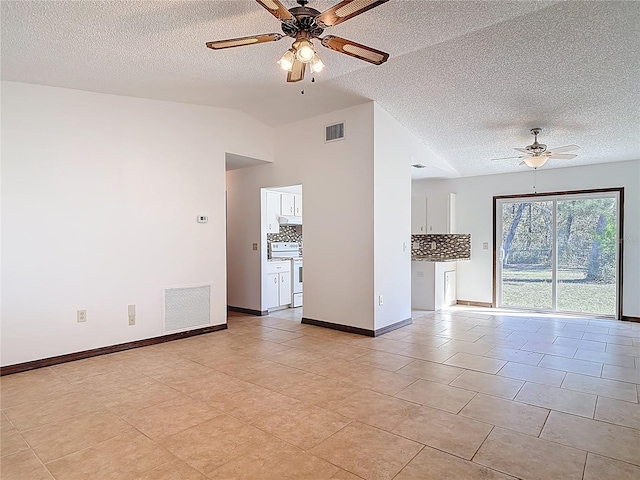 unfurnished room with visible vents, lofted ceiling, baseboards, and ceiling fan