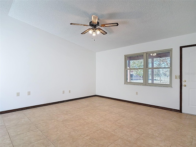 unfurnished room featuring a textured ceiling, baseboards, and ceiling fan