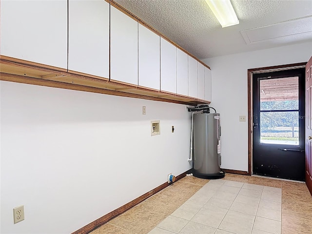 laundry room with baseboards, water heater, hookup for a washing machine, cabinet space, and a textured ceiling