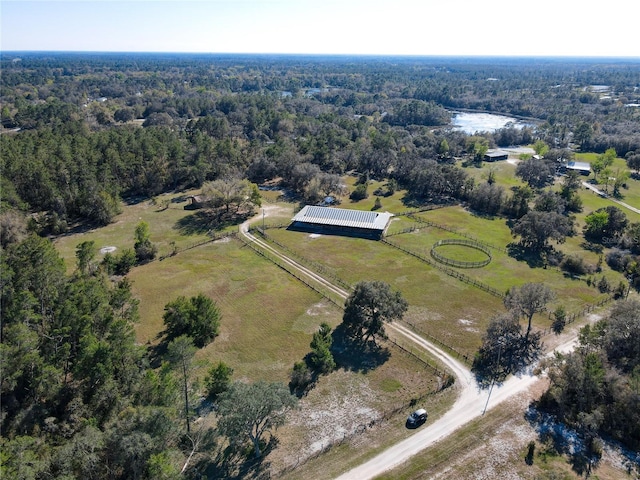 drone / aerial view with a rural view and a wooded view