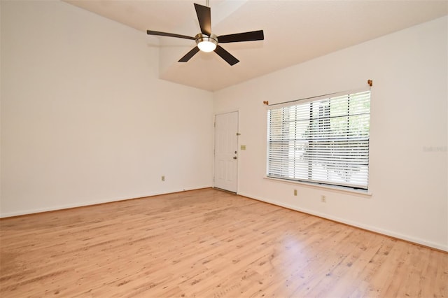 unfurnished room featuring baseboards, light wood-type flooring, and a ceiling fan