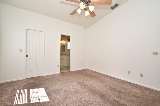 unfurnished bedroom featuring visible vents, ensuite bath, baseboards, and carpet floors