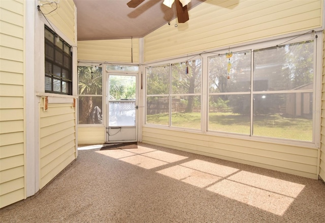 unfurnished sunroom featuring ceiling fan and lofted ceiling