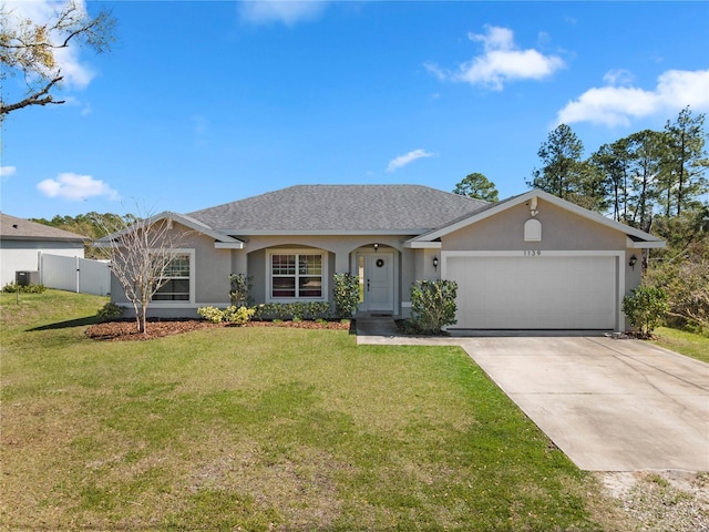 single story home with stucco siding, driveway, a front lawn, fence, and a garage