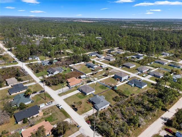 aerial view featuring a wooded view