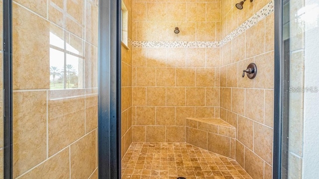 full bath featuring a shower stall