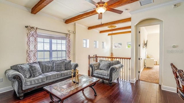 living area with visible vents, baseboards, beamed ceiling, arched walkways, and dark wood-style floors