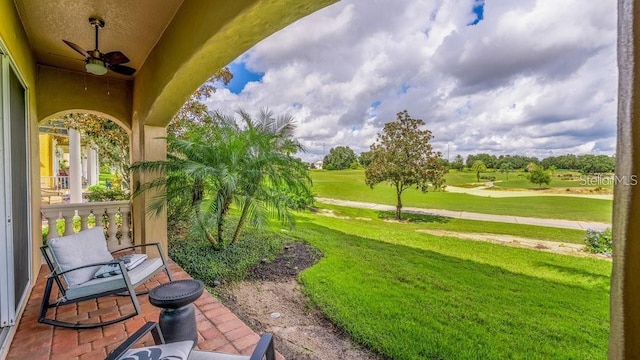 view of yard with a ceiling fan