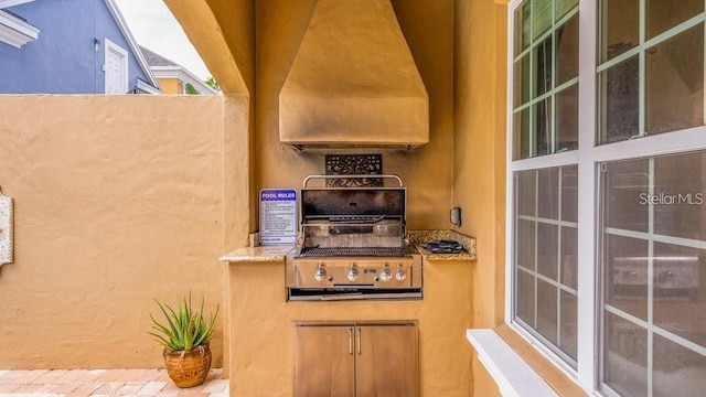 view of patio / terrace featuring area for grilling and an outdoor kitchen