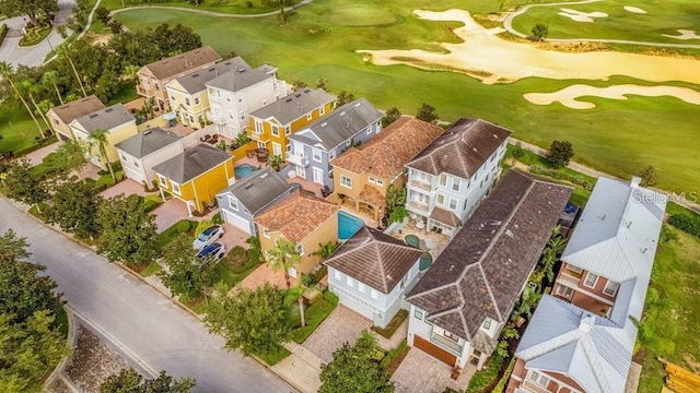 drone / aerial view featuring a residential view and golf course view