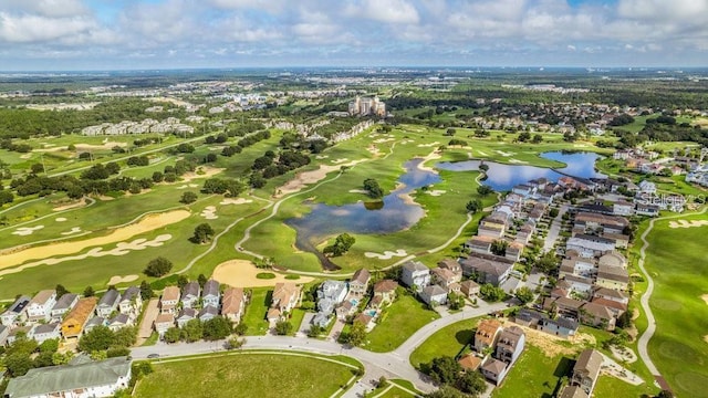 aerial view featuring view of golf course, a water view, and a residential view