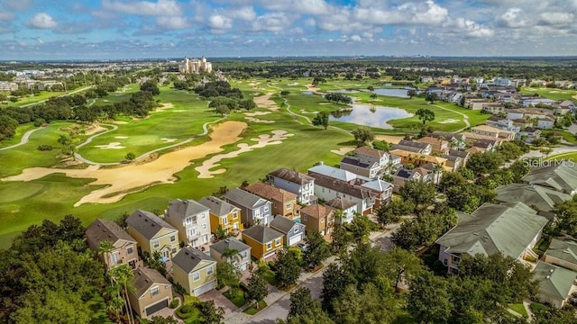 birds eye view of property with a residential view, golf course view, and a water view