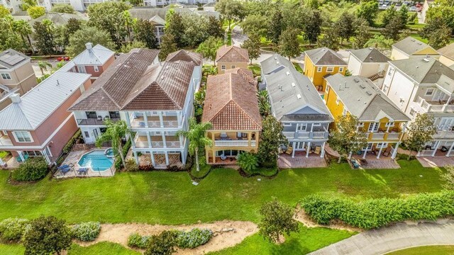 birds eye view of property with a residential view