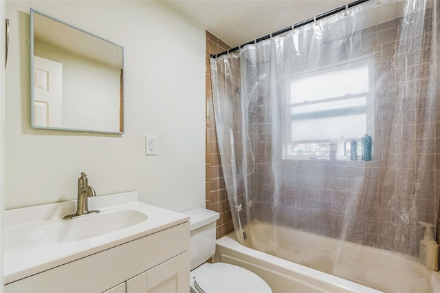 full bathroom with vanity, toilet, and shower / tub combo with curtain