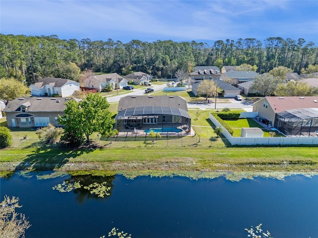 birds eye view of property with a residential view and a water view