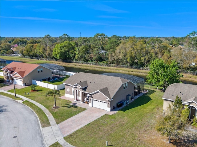 birds eye view of property featuring a wooded view