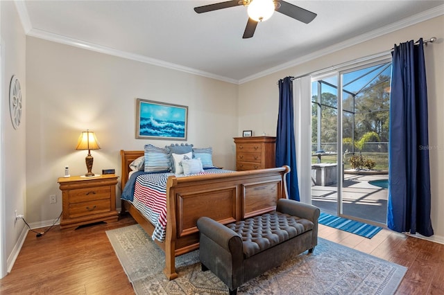 bedroom featuring wood finished floors, crown molding, and access to outside