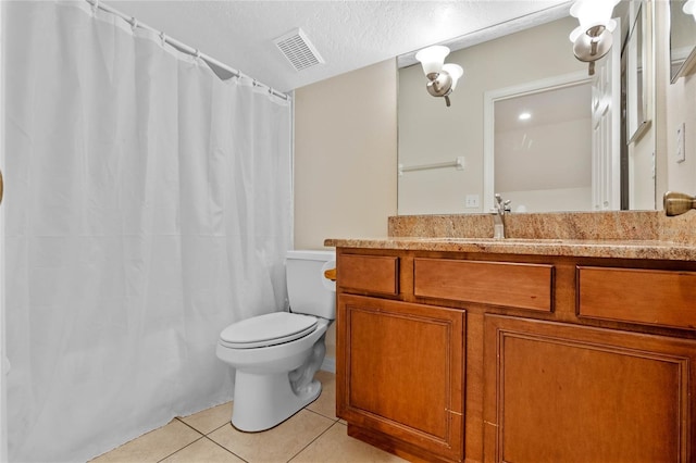 full bath featuring tile patterned floors, visible vents, toilet, a textured ceiling, and vanity