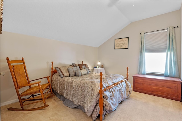 bedroom with light carpet, baseboards, and lofted ceiling