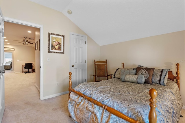 bedroom featuring lofted ceiling, baseboards, and light carpet