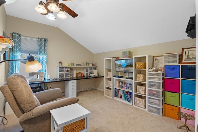 living area featuring ceiling fan, lofted ceiling, and carpet floors