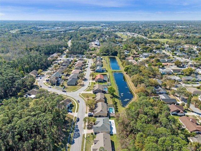 drone / aerial view with a water view and a residential view