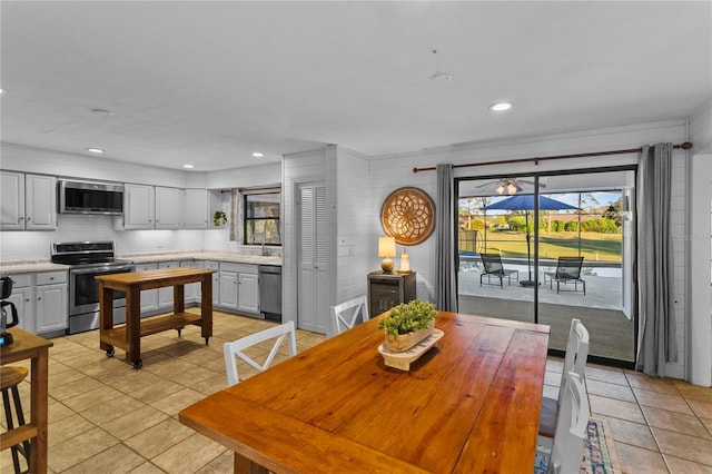 dining area featuring light tile patterned floors and recessed lighting