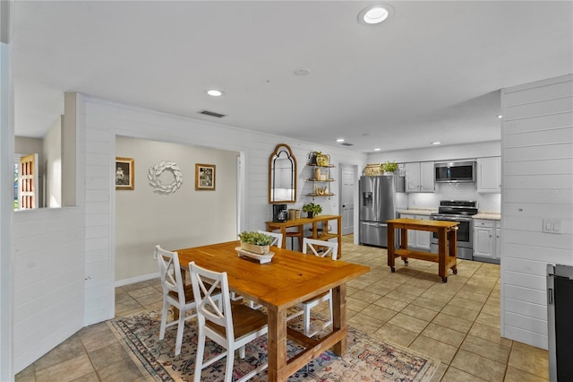 dining space with light tile patterned floors, recessed lighting, visible vents, and baseboards